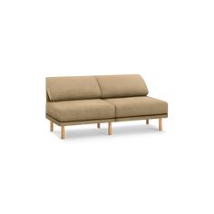 a beige couch sitting on top of a white floor