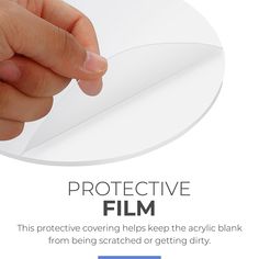 a hand holding a piece of paper with the words protective film on it and an image of