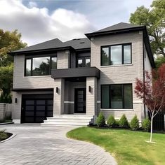 a two story house with lots of windows