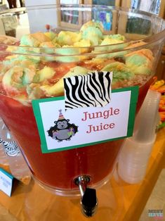 a bowl filled with jungle juice sitting on top of a table