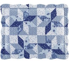 a blue and white patchwork quilt with stars on it