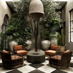 an outdoor living room with potted plants and chairs