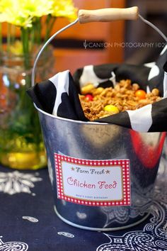 a bucket filled with food sitting on top of a table