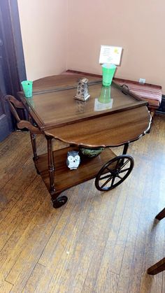 a wooden table sitting on top of a hard wood floor