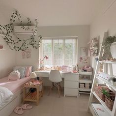 a bedroom with white furniture and pink accessories on the walls, along with lots of windows