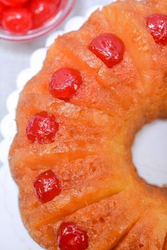 a pineapple upside down cake with cherries on it