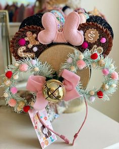 a close up of a minnie mouse head on a table