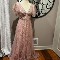 a dress on display in front of a mirror