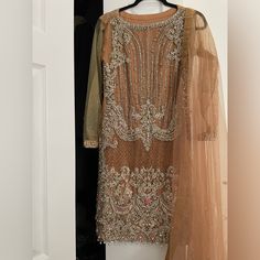 Beautiful Pakistani Indian Formal Dress With Heavy Zardozi Work. The Dress Is In Size Xs/Small Comes With Skirt Bottom And Dupatta. The Sleeves Show Little Sign Of Wear Besides That Almost New. Top- Chest 34" Length 36 Bottom Length - 44" Semi-stitched Gold Dress With Dupatta, Gold Floor-length Dupatta For Eid, Floor-length Gold Georgette Dupatta, Gold Floor-length Dupatta With Dabka, Gold Embellished Bollywood Dupatta, Indian Formal Dresses, Zardozi Work, Formal Dress, Dresses Xs