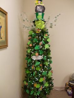 a decorated christmas tree in the corner of a room