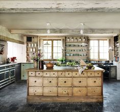 an open book showing the inside of a kitchen