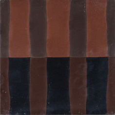 a brown and black striped tile is shown in the middle of an image with no background