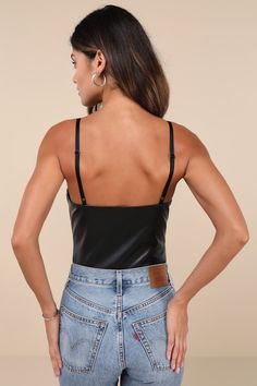 Going-out? Make sure you slip on the Lulus Sleek Vibes Black Vegan Leather V-Neck Sleeveless Bodysuit for a night of compliments! Smooth faux leather shapes this ultra-flirty bodysuit with adjustable spaghetti straps, a V-neckline, and a triangle-style bust. Figure-fitting bodice finishes with attached, mesh thong bottoms with snap closures. Fit: This garment fits true to size. Length: Size medium measures 23" from adjustable straps to hem. Bust: Great for any cup size. Waist: Fitted - very fitt Nashville Outfits, Adhesive Bra, Black Vegan, Sleeveless Bodysuit, Strapless Bra, Cup Size, Vegan Leather, Spaghetti Strap, Adjustable Straps