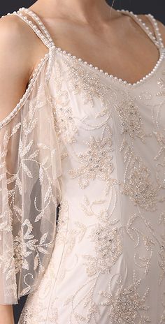 the back of a woman's dress with beading on it