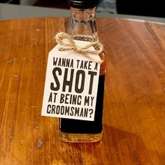 a bottle with a label on it that says, wanna take shot at being my groomsman?