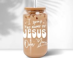 a mason jar with the words i speak to the name of jesus on it