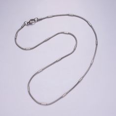 If you receive a defective item, please contact us within 5 days of arrival Item Details - Material: Brass, white gold filled Closure: Lobster clasp Chain style: Beaded snake Length: 18.7 inches Width: 2.0 mm Please avoid exposure to water or chemical solutions. Keep in a dry environment. Minimalist White Gold Chain Necklace, White Gold Snake Chain Jewelry With Lobster Clasp, Minimalist Stainless Steel Chain Necklace, Minimalist Metal Snake Chain Jewelry, Minimalist White Snake Chain Jewelry, White Minimalist Snake Chain Jewelry, Minimalist White Gold Snake Chain Jewelry, Minimalist White Gold Metal Necklace, Minimalist White Gold Stainless Steel Necklace