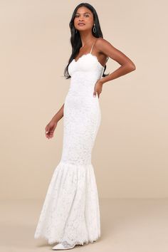 There's nothing like stepping into a room wearing the Lulus Instinctively Stunning White Lace Bustier Trumpet Maxi Dress! This elevated dress is composed of gorgeous lace that shapes a bustier-style bodice with a sweetheart neckline, eyelash lace trim, and padded cups, all supported by adjustable spaghetti straps. Figure-hugging silhouette is sure to catch you some compliments as it falls to a tiered, trumpet-style maxi hem with three layers of hidden tulle for volume. Hidden zipper/clasp at bac Casual Formal Dresses, Derby Dress, Rush Dresses, Latest Fashion Dresses, Fairy Dresses, Hugging Silhouette, Long White Dress, Lace Bustier, Feather Dress