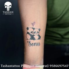 a panda bear tattoo with the word sonu on it's left arm and two panda bears hugging each other