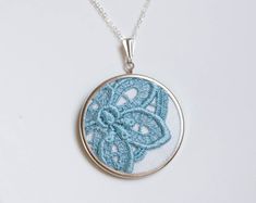 Lace necklace with ocean blue lace l016 Delicate Blue Necklace For Wedding, Handmade Lace Jewelry For Gifts, Delicate Handmade Blue Necklace, Handmade Blue Wedding Necklaces, Blue Round Pendant Necklaces For Weddings, Blue Round Pendant Necklace For Wedding, Cross Stitch Necklace, Hand Embroidered Jewelry, Textile Necklace