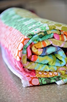 a stack of cloths sitting on top of a table