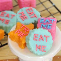 some cookies that are sitting on a plate with words written on them and stars in the middle