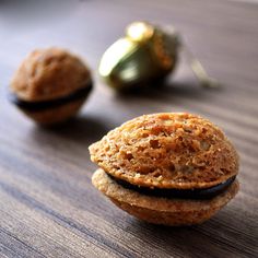 two cookies sitting on top of a wooden table