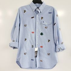 Ralph Lauren Men's Embroidered Varsity Oxford Button Down Shirt Size: Men's Small Color: Blue With Multiple Embroidery Can Dress Up Or Down Spare Buttons New With Tags Excellent Condition Fun, Preppy Look Casual Long Sleeve Shirt With Embroidered Logo, Light Blue Embroidered Cotton Shirt, Light Blue Cotton Embroidered Shirt, Casual Blue Embroidered Shirt, Casual Long Sleeve Shirt With Embroidered Graphics, Blue Embroidered Collared Shirt, Light Blue Embroidered Casual Shirt, Casual Light Blue Embroidered Shirt, Ralph Lauren Blue Top With Buttons