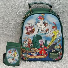 New Loungefly Disney's Peter Pan Portrait Featuring Peter Pan, Captain Hook Pirate, Wendy, Tinker Bell Fairy, The Lost Boys And Others Mini Backpack And Coin Purse Set. See Pictures For More Details And Measurements. Coin Purse Is Approx 3"X5". Price Is Firm. Please Do Not Send Offers Unless Bundled With Other Items With A Reasonable Offer. Combine Orders Into A Bundle And Pay For Only One Shipping. C-36 C-70 Disney Green Travel Bags, Green Disney Travel Bag, Disney Green Backpack, Green Disney Backpack, Themed Travel Backpack Bags, Green Disney Style Bags For Daily Use, Themed Multicolor Travel Bag, Green Disney Bags For Everyday Use, Disney Rectangular Backpack For Everyday Use