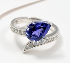 The cool violet-blue hue of this heat treated tanzanite ring may just be your new favorite color (if it isn't already!). Diamonds on the bypass design complement the charismatic color with chic shimmer. From Pure Tanzanite by Jeff Moseley. Tanzanite Diamond Ring, This Heat, Tanzanite Diamond, Tanzanite Ring, Tanzanite Gemstone, Ring Size Guide, Blue Hues, The Cool, Diamond White