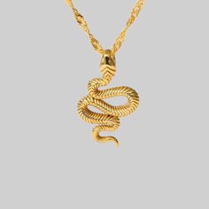 A small snake pendant necklace is the focal point of this delicate and timeless twist chain necklace. This babe is delicate and feminine, but still bold enough to get noticed. Waterproof & Tarnish Resistant Material: Stainless Steel with a thick layer of 18k Gold Closure: Lobster Clasp Color: White Cubic Zirconia Approximate Measurements: 16" Length with 2" Extender Approximate Pendant Measurements: 25mm length, 15 mm wide Tarnish Resistant Snake Chain Necklace, Tarnish Resistant Snake Chain Charm Necklace, Snake Chain Necklace For Gift, Minimalist Gold Snake Necklace, Small Snake, Small Snakes, Freshwater Pearl Jewelry, Snake Pendant, Gold Plated Jewelry