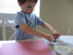 a little boy that is sitting at a table