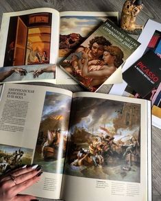 an open book with pictures of people and paintings on the pages next to each other