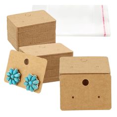 three cardboard boxes with blue flowers on them