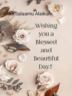 some flowers and leaves on a white background with the words good morning wishing you a blessed and beautiful day