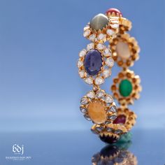 Navratan Jewellery, Elegant Multicolor Stone Work Chandbalis, Jadau Bracelet, Navratna Bangle Designs, Navratan Bangles, Kundan Stone Setting Bangle, Bollywood Bangle With Stone Work, Kundan Jewellery Set, Online Gold Jewellery