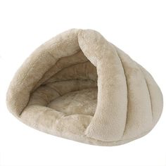 a cat bed that is made out of fleey material and has a large, round shaped