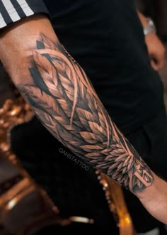 a man with a tattoo on his arm