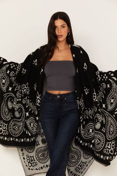 Kyle Bandana Print Blanket Shawl – Idyllwind Fueled by Miranda Lambert Black Oversized Outerwear For Festivals, Casual Black Outerwear With Frayed Hem, Black Jacquard Knit Casual Outerwear, Casual Black Jacquard Knit Outerwear, Trendy Black One-size Outerwear, Black Cotton Festival Outerwear, Black Cotton Outerwear For Festivals, Trendy Black Outerwear For Festival, Paisley Border