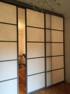 an empty room with sliding doors in it