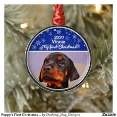 a dog ornament hanging from a christmas tree