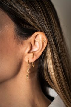 Embrace the trend with our "Hiss" earrings – featuring a small hoop with a dangling snake for a touch of mystique. These earrings capture the allure of serpentine elegance and add a bold statement to your look. The snakes are back, and they're ready to slither into your style with the chic charm of our "Hiss" earrings. 925 Sterling Silver 18k Gold Plated Nickel Free & Hypoallergenic Snake Shape Earrings For Party, Gold Snake-shaped Earrings With Pierced Ears, Gold Snake-shaped Jewelry With Pierced Ears, Gold Snake Jewelry For Pierced Ears, Trendy Snake-shaped Jewelry For Parties, Trendy Snake-shaped Party Jewelry, Trendy Snake-shaped Earrings For Gifts, Party Huggie Dangle Earrings, Elegant Snake-shaped Single Earring