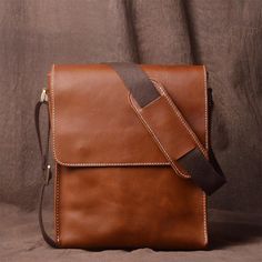 The full grain brown genuine leather sling bag for guys is expertly created to enhance both the look and practicality of your loved one. This adaptable shoulder crossbody purse embodies style and functionality, making it the ideal present for any occasion--be it your father, brother, or spouse.  Fine Full Grain Leather: This sling bag is crafted from the best full grain leather, offering unmatched quality and a deep, natural brown colour that gets darker with time to give character and charm.  Effortless Style: This messenger bag is meant to be a fashionable and useful companion for the contemporary man on the go. It radiates subtle elegance.  Adaptable Strap: This bag's adjustable shoulder strap and many compartments making it a flexible option. It's ideal for daily use, travel, employmen Cheap Men's Rectangular Bags, Cheap Men's Rectangular Shoulder Bag, Cheap Functional Men's Shoulder Bag, Practical Men's Cheap Shoulder Bag, Men's Solid Rectangular Bags, Cheap Everyday Men's Shoulder Bag, Cheap Rectangular Men's Bags, Modern Inexpensive Men's Bags, Cheap Brown Men's Chest Bag