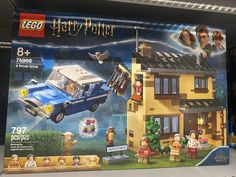 a lego harry potter set is displayed on the shelf in front of some bookshelves