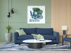 a living room with blue couches and green walls