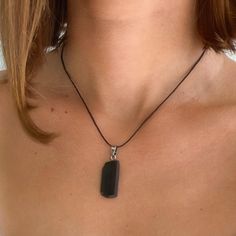 Black tourmaline is a powerful and protective stone, and wearing one or carrying it around with you on your person will keep you safe. We provide our black tourmaline pendants with a great leather necklace that easily lets them become an elegant accessory for when they're not being used to combat trouble in the form of bad luck.

Category: Tourmaline Necklace