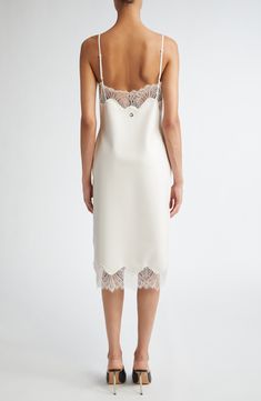 From the brand's prefall '24 collection, this slipdress leans into the classic lingerie look of an actual slip with its lace-trimmed neckline and hem. Where it redefines the style is in its construction from latex, giving it both a cling-free fit and a milky-white appearance. A polished metal Coperni logo is pinned at the center of the back. 38" center front length (size Medium) Slips on over head V-neck Adjustable straps Unlined Contains natural rubber latex Latex/silicone Hand wash, dry flat M White Latex Dress, Classic Lingerie, Dreamy Dress, Milky White, Silk Slip, Fabric Gift Bags, Fabric Gifts, Free Fabric, Anniversary Sale