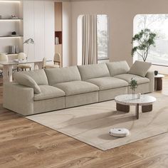 a living room with a couch, coffee table and other items on the wooden floor