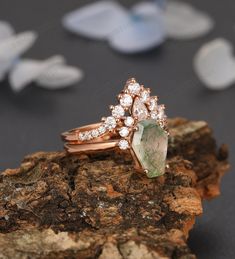 a close up of a ring on top of a rock