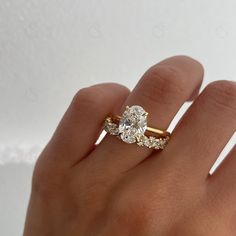 Elevate your love story with our stunning 2.50 CT Oval Cut Moissanite Engagement Ring Set, featuring a beautiful vintage hidden halo and a matching round marquise cut band crafted in luxurious 14kt gold. This exquisite Moissanite Engagement Ring Set radiates brilliance and timeless elegance, making it the perfect promise gift for your forever partner--make this symbol of your love a cherished centerpiece in their life today! ✥ Main Stone Details ✥ ↣ Shape: Oval Cut Moissanite Diamond ↣ Weight: 2 Gold Band Engagement Rings, Oval Cut Moissanite Engagement Ring, Dream Wedding Ring, Moissanite Wedding Ring Set, Stacked Wedding Bands, Moissanite Engagement Ring Set, Cute Engagement Rings, Wedding Rings Round